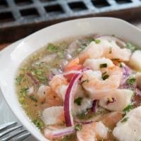 Ceviche Mixto · A healthy alternative, fish, calamari and shrimp marinated in fresh lemon juice served chill...