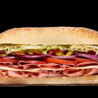 Italian Style · Genoa salami and capicola with Provolone cheese, lettuce, tomato, onion, hot peppers, oil an...