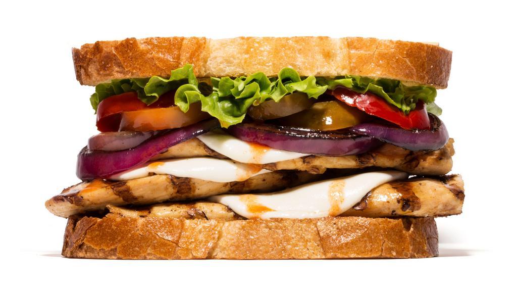 Spicy Chicken Sandwich · Grilled chicken breast with melted fresh mozzarella cheese, grilled onion, green leaf lettuce, hot peppers and Tabasco sauce. Spicy.