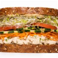 Tuna Dijon Sandwich · Tuna salad, carrot, cucumber, alfalfa sprouts, tomato and dijon mustard.