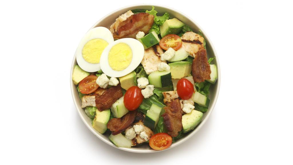 Cobb Salad · Grilled chicken, avocado, bacon bits, crumbled bleu cheese, cucumber, hard boiled egg, romaine lettuce and tomato.