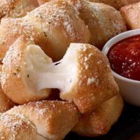Stuffed Garlic Knots · 10 pieces. Filled with melted cheese. Served with marinara dipping sauce.