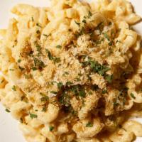 Truffle Mac And Cheese · Macaroni prepared with freshly made cheese sauce, beurre noisette, bread crumbs and white tr...