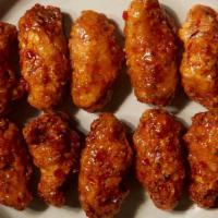Mango Habanero Wings · 10 pc of Bell ＆ Evans wings in tropical mangoes emulsified with blended habaneros. Served wi...