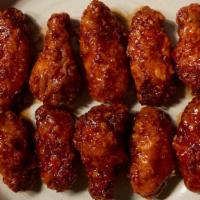 Garlic Chili Wings  · 10 pc of Bell ＆ Evans wings in Korean style chili garlic sauce that is sweet and savory. Ser...