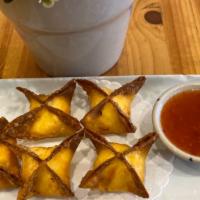 Crab Rangoon · Crab meat, cream cheese in a crispy wonton served with a spicy and sweet chili sauce.