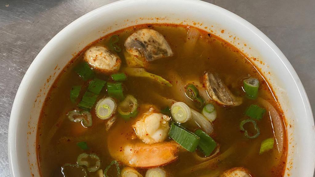 Tom Yum Shrimp Soup · Spicy hot and sour soup with lemongrass, mushroom, carrot, onion and scallion.