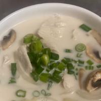 Tom Kha Chicken Soup · Coconut soup with mushroom, onion, scallion, carrot and galangal.