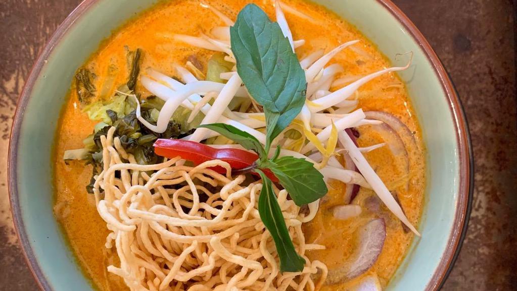Khao Soi · Northern style curry with chicken (mini drumsticks), bean sprouts, pickle, red onion, dried chili and crispy egg noodle.
