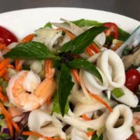 Seafood Salad · Shrimp, calamari, mussels, scallion, onion, grape tomato in spicy chili dressing