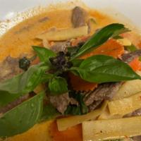 Gaeng Dang · Red curry. Thai style red curry with bamboo shoot, basil leaves, carrot, eggplant and bell p...