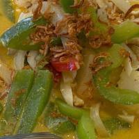 Gaeng Karee · Yellow curry. Yellow curry paste with tomato, potato, bell pepper and onion simmered in coco...