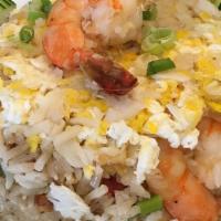 Shrimp And Crab Meat Fried Rice · Stir-fried rice with shrimp and white crab meat, eggs, onions, tomatoes and scallions.