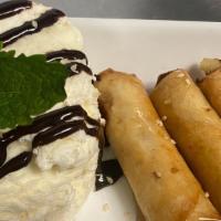 Fried Banana With Coconut Ice Cream · Fried banana wrapped with egg roll skin,honey topping and coconut ice cream