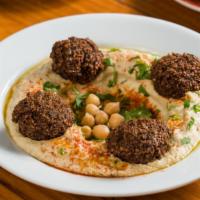 Hummus & Falafel Platter · with spicy green schug, tahini, & chickpeas