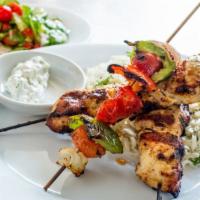 Chicken Grill · grilled chicken marinated in house-made spice blend, served over herbed rice, grilled vegeta...