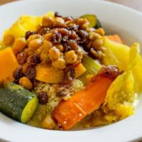 Vegetable Couscous · braised butternut squash, carrots, zucchini, celery, turnips, served over a bed of fluffy co...