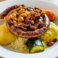 Merguez Couscous · house-made spicy lamb & beef sausage, braised butternut squash, carrots, zucchini, celery, t...