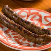 Merguez Sausage Side · House-made spicy lamb & beef sausage.