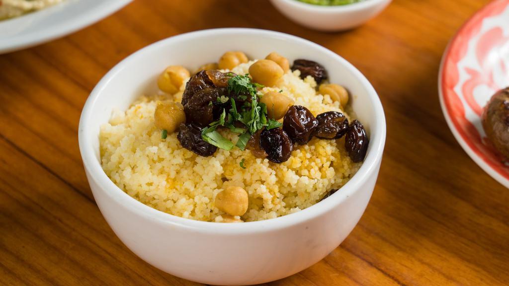 Side Of Couscous · With chickpeas, raisins, & caramelized onions