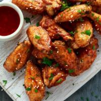 Honey Bbq Wings · Mouth-watering juicy crispy wings tossed with honey BBQ sauce, served with fresh crispy hand...