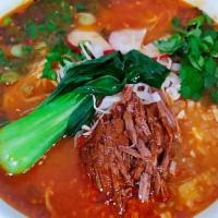 Birria Beef Ramen · wavy noodle, soy sauce based topped with white onions, scallions, cilantro, cabbage, radish ...