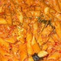 Vodka Sauce Pasta · Pink cream vodka sauce with meat sauce.