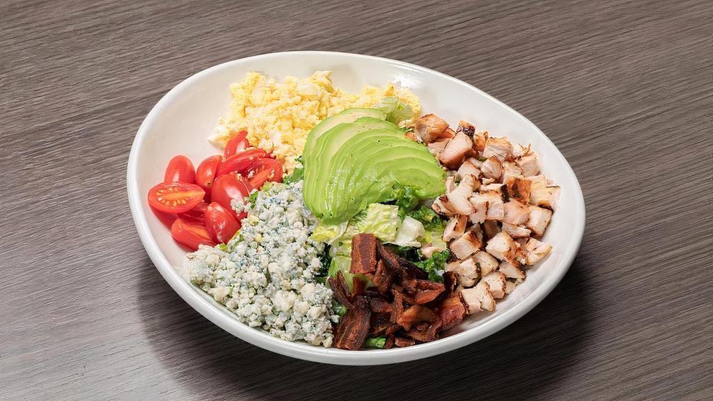 Cobb Salad · Grilled chicken, bacon, avocado, blue cheese, cherry tomatoes, hard-boiled egg, buttermilk ranch dressing.