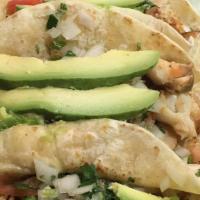 Tacos Con Todo · Tacos with everything onions cilantro lettuce tomato cream and cheese.