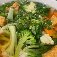 Phở Chay · Vegetarian Broth + Noodles.  Broccoli, Bok Choy, Tofu, Cauliflower, Carrots.