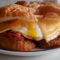 Becon Egg And Cheese Sandwich On A Croissant · Jumbo egg cooked to perfection with crispy bacon and american cheese on a  a Flakey Croissant