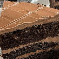 Slice Of Chocolate Cake · Super Moist Chocolate Cake filled with chocolate buttercream and iced with chocolate fudge.