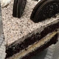 Slice Of Oreo & Cream Cake · Vanilla and chocolate cake filled and iced with crushed oreo buttercream.