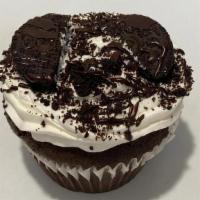 Oreo’S And Cream Colossal Cupcake · Delicious Chocolate cupcake with crushed Oreo icing, an Oreo and drizzled with chocolate.