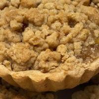 Apple Crumb Tart · Flakey buttery cookie tart filled with fresh apples and topped with delicious crumbs.