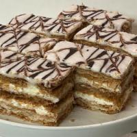 Large Napoleon · 3 layers of Flaky Pastry dough filled with light Italian custard iced with vanilla icing and...