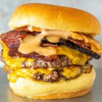 Double Ram Burger · American cheese, thick cut bacon, potato chips and House Sauce