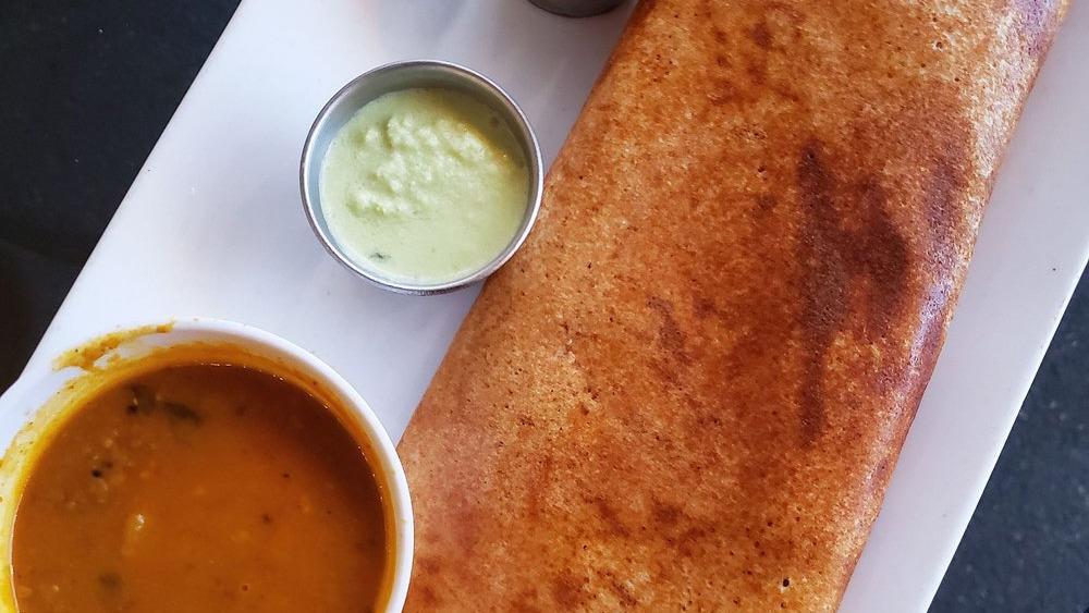 Masala Dosa · Authentic rice and lentil crispy crepe served with spiced potatoes and coconut chutney and spiced lentil soup.