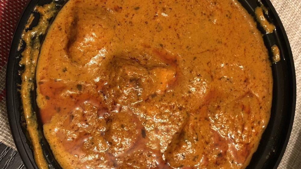 Dhaba Curry · Chef special authentic country style chicken on bone in a flavorful curry.