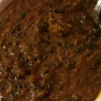 Dal Bukhara · North Indian special mix black lentil slow cooked in aromatic spices.