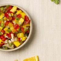 Mango Salsa · Cubed Mango, Red Bell Peppers, Jalapeno Pweppers & Cilantro