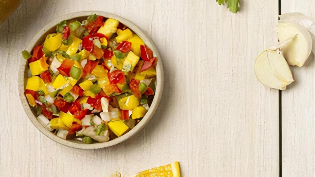 Mango Salsa · Cubed Mango, Red Bell Peppers, Jalapeno Pweppers & Cilantro