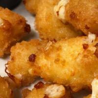 Fried Cheese Curds · Panko crusted cheddar curds, flash-fried, and served with spicy red pepper jam
