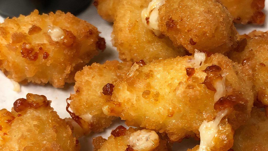 Fried Cheese Curds · Panko crusted cheddar curds, flash-fried, and served with spicy red pepper jam
