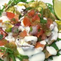 Shrimp Tostada · Flash-fried tortilla topped with grilled shrimp, pico, avocado crema, and salsa verde