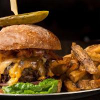 The Bourbon Burger · A BBQ burger with bacon, cheddar cheese, sautéed onion, BBQ bourbon glaze, and romaine leaf ...