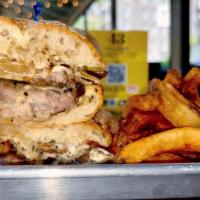 Ultimate Steak Sandwich · Sliced sirloin steak packed with mushrooms and onions, local beer cheese and garlic mayo on ...