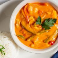 Shrimp Stew / Moqueca De Camarao · Slow cooked shrimp, palm oil, coconut milk, tomato, onion, green pepper. Served with rice.