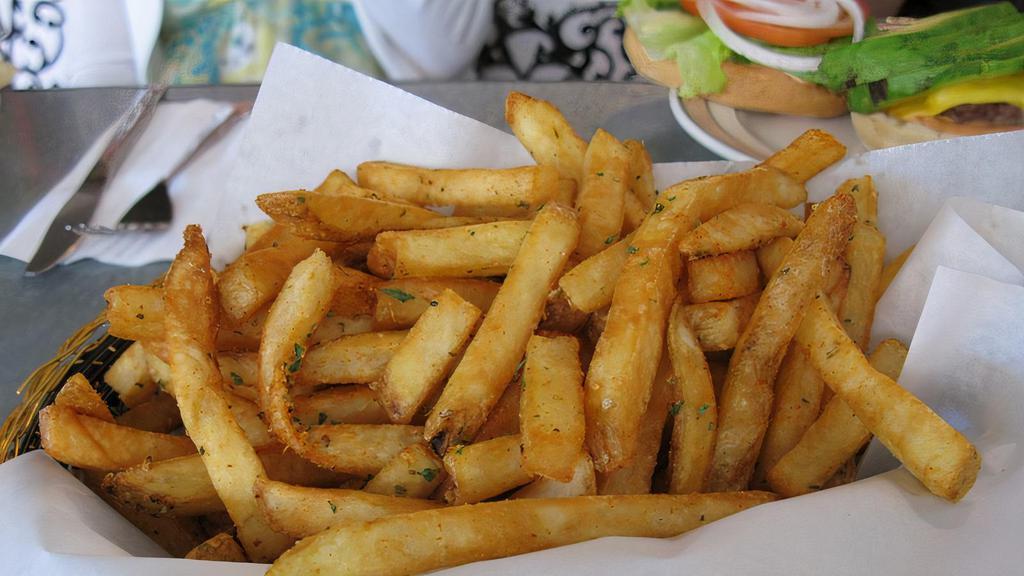 Steak Fries · Basket of salted steak fries.
