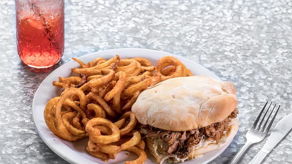 Squealer Delight · Slow-cooked pulled pork.  Vegan option now available!  Served with coleslaw, Swiss cheese, and BBQ sauce on a toasted potato bun.